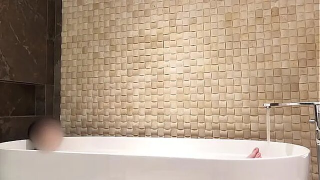 Japanese cutie soaks in bubble bath at luxury hotel