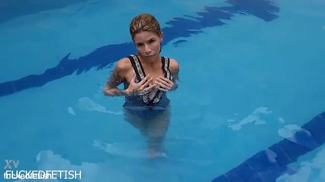 Ashlee Rose in sexy silver dress dives into pool