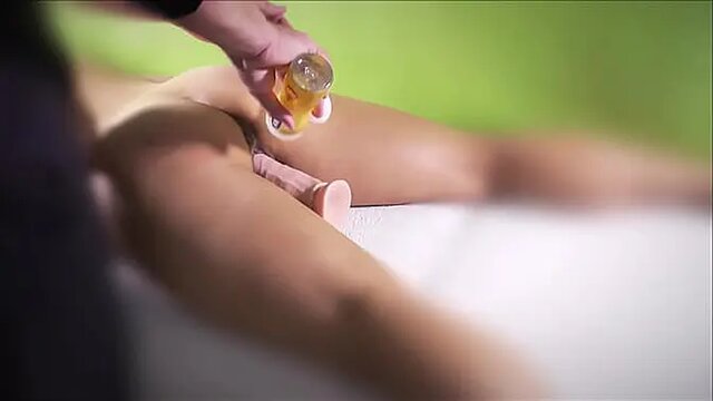 Amateur babe gets her pussy stimulated with oil before gangbang